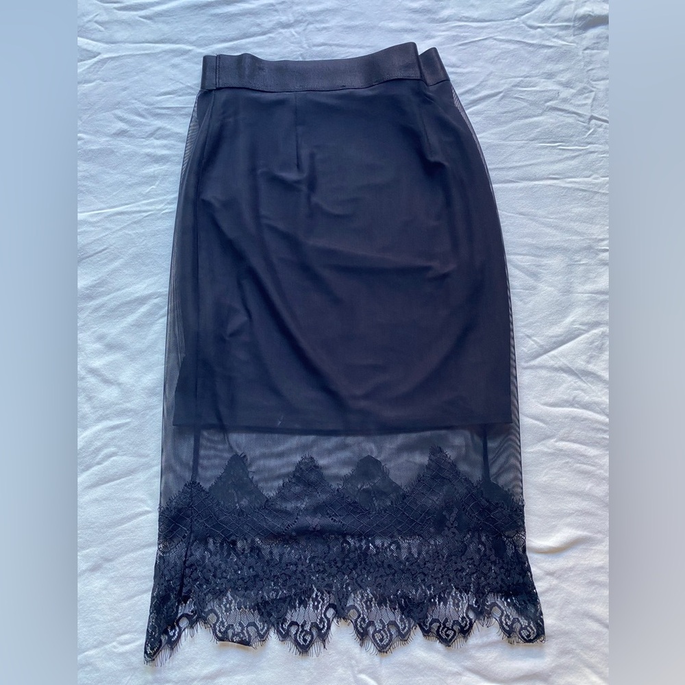 Bebe black elastic waist pencil skirt. Lace trim. Size small.